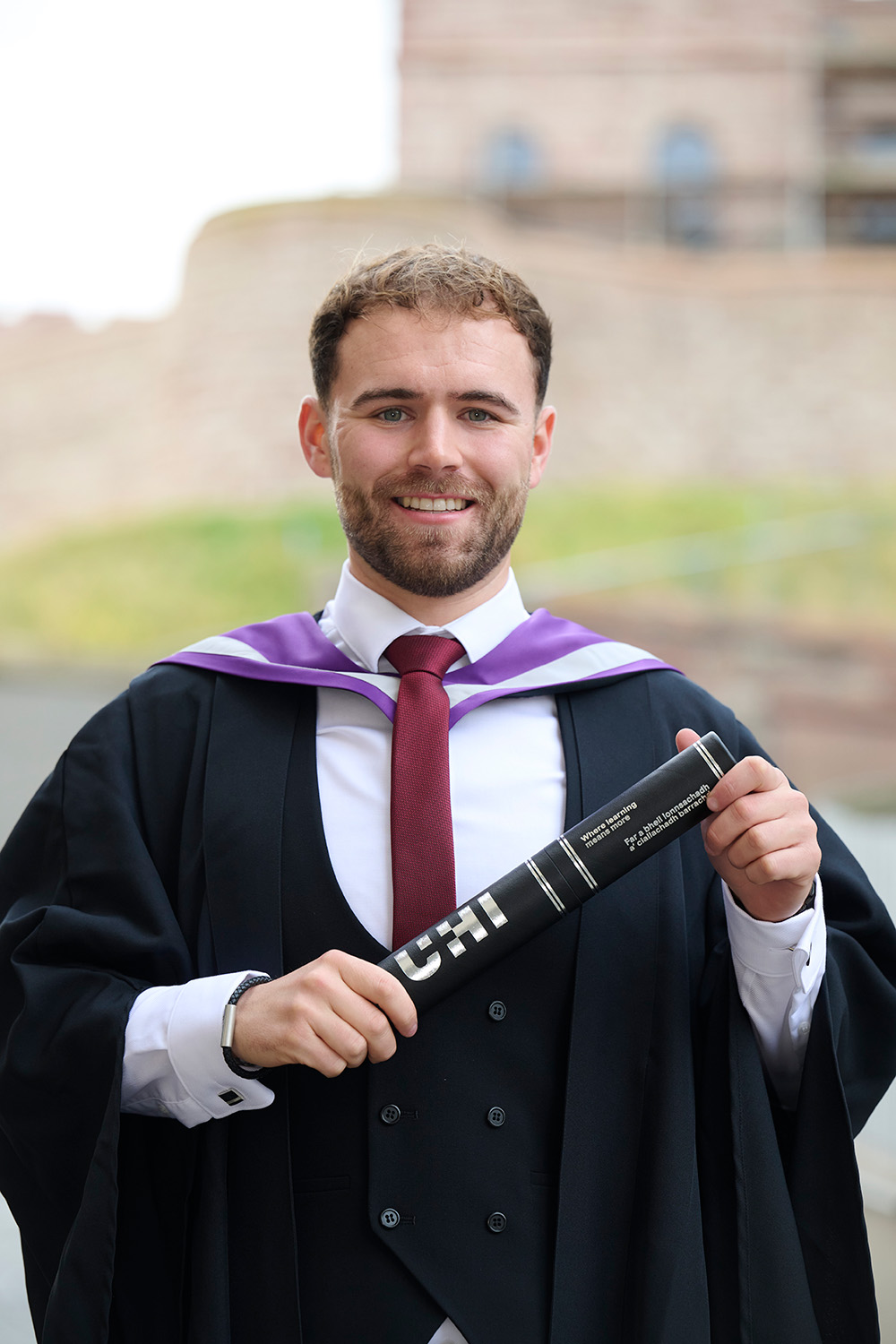 Ewan Gordon holding her scroll