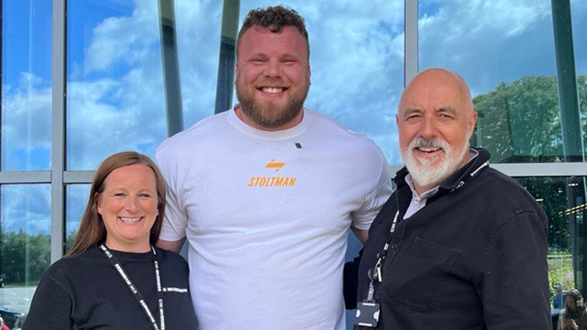 Kirsten Grant, Tom Stoltman and Chris O'Neil standing together