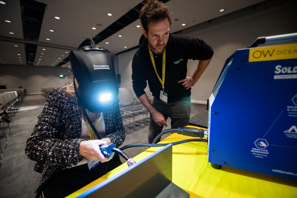 A student trying a VR Welding Simulator