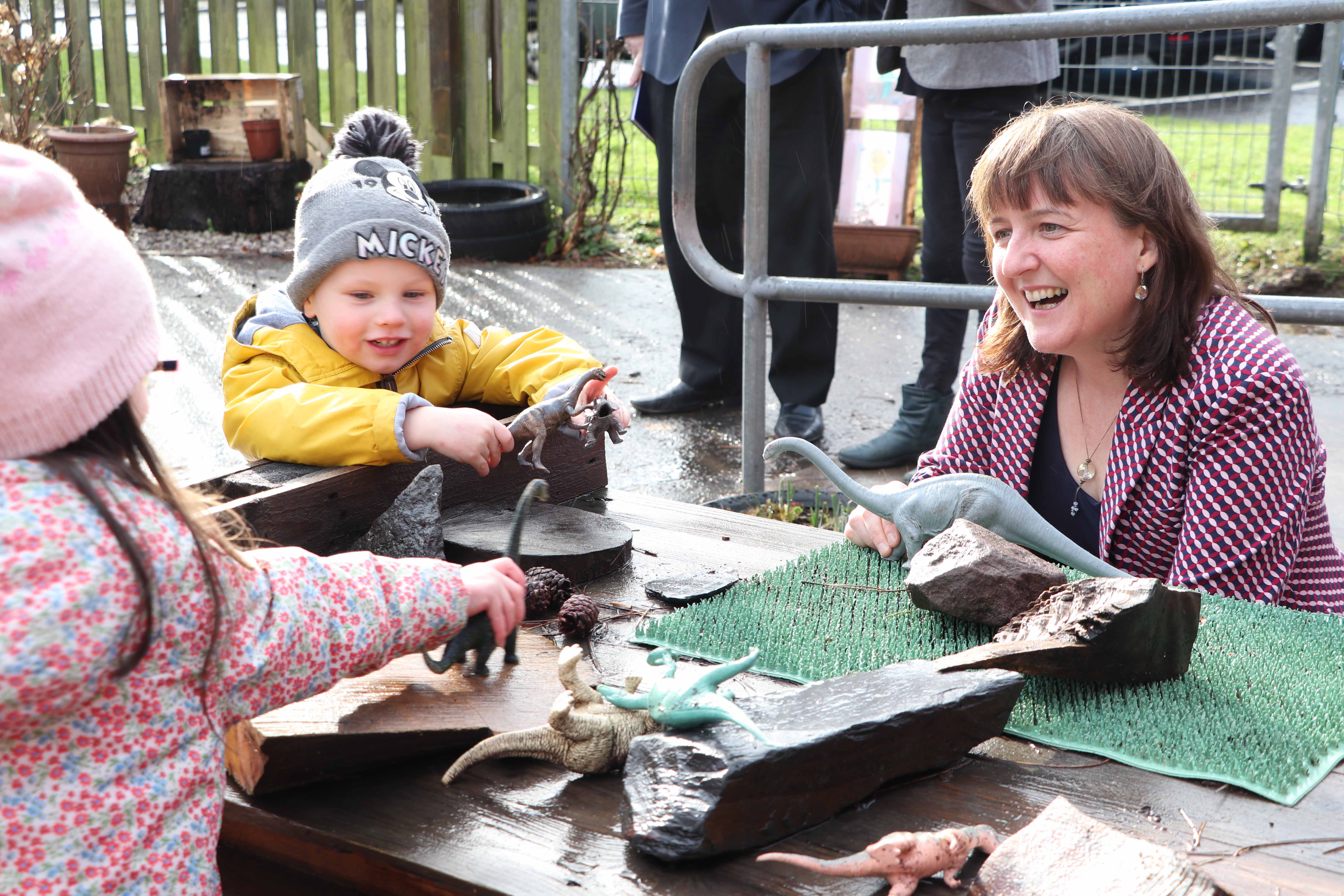 Minister meets nursery children in playground