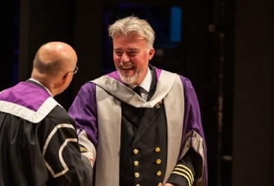 Ian Macneil in UHI gown at graduation ceremony