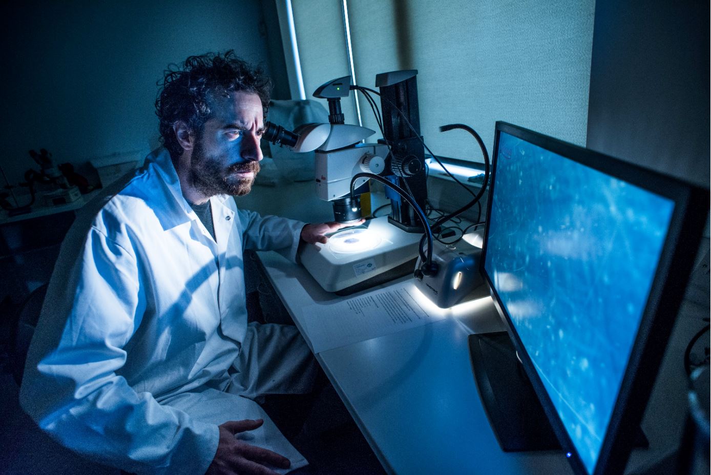 A researcher checking water samples