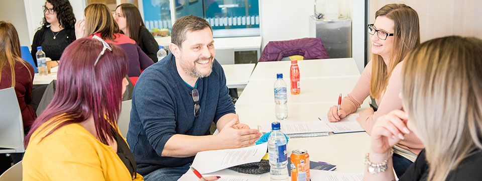 A lecturer and students during conversation at the 2019 psychology residential